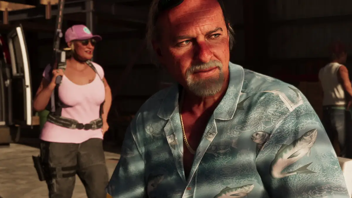 an older man in a fish print shirt in a hangar while an armed woman in a pink cap waits behind him in an official GTA 6 screenshot