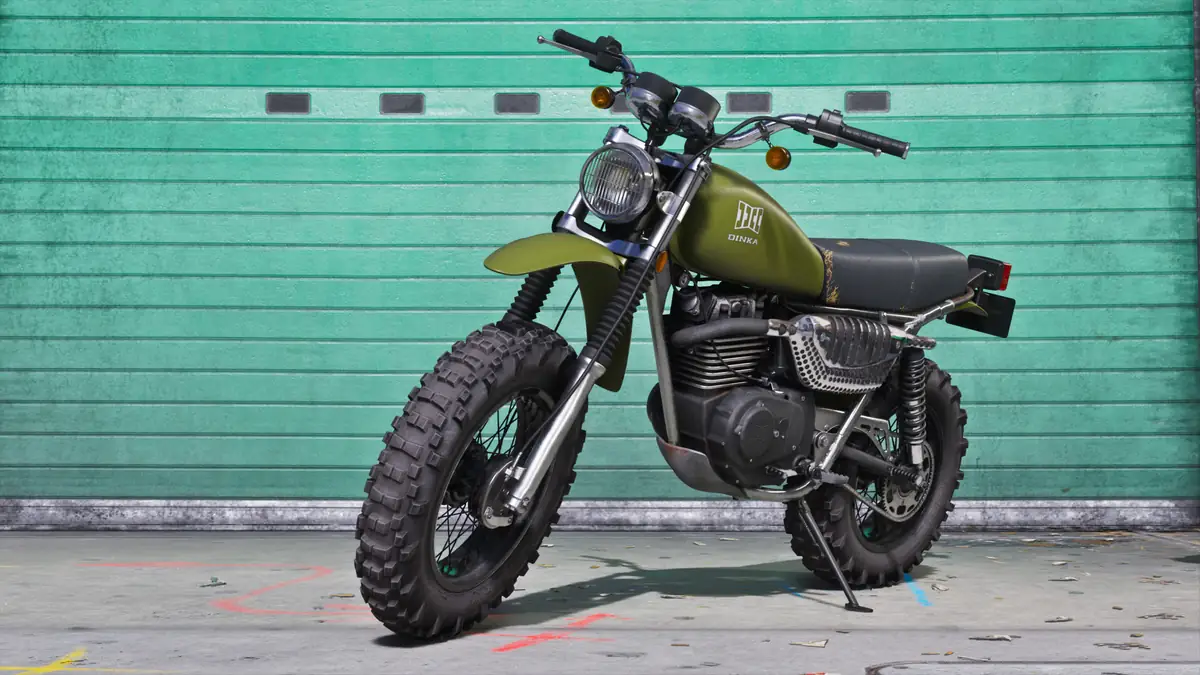 a green dirt bike parked in front of a teal garage door in an official GTA 6 image
